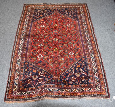 Lot 1187 - A Khamseh Rug, the blood red field with a one...