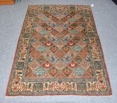 Lot 1186 - A Ghom Rug, the polychrome diamond lattice...