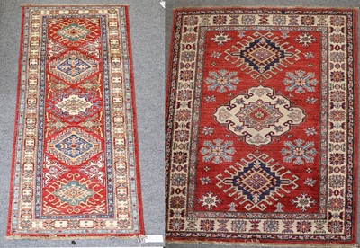 Lot 1289 - Afghan Rug, The blood red field with three...