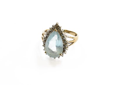 Lot 136 - A Blue Topaz and Diamond Cluster Ring, stamped...