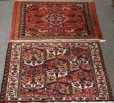 Lot 1162 - A Bakhtiari Rug, the polychrome lattice field...