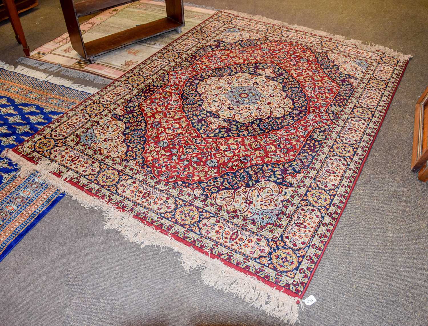 Lot 1105 - A Machine Made Rug of Oriental Design, the