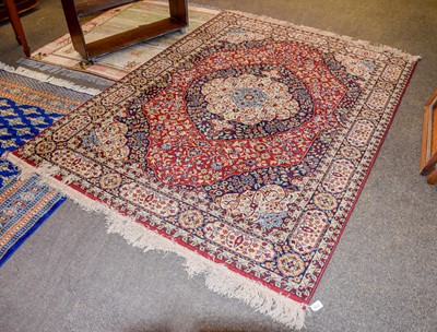 Lot 1105 - A Machine Made Rug of Oriental Design, the...