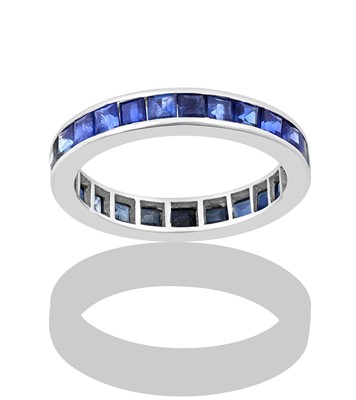 Lot 2267 - A Sapphire Eternity Ring the calibré cut...