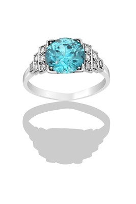 Lot 2332 - A Blue Zircon and Diamond Ring the round cut...