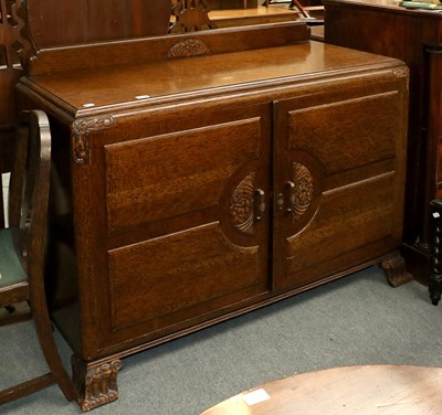 Lot 1337 - A 1920's Carved Oak Dining Room Suite,...