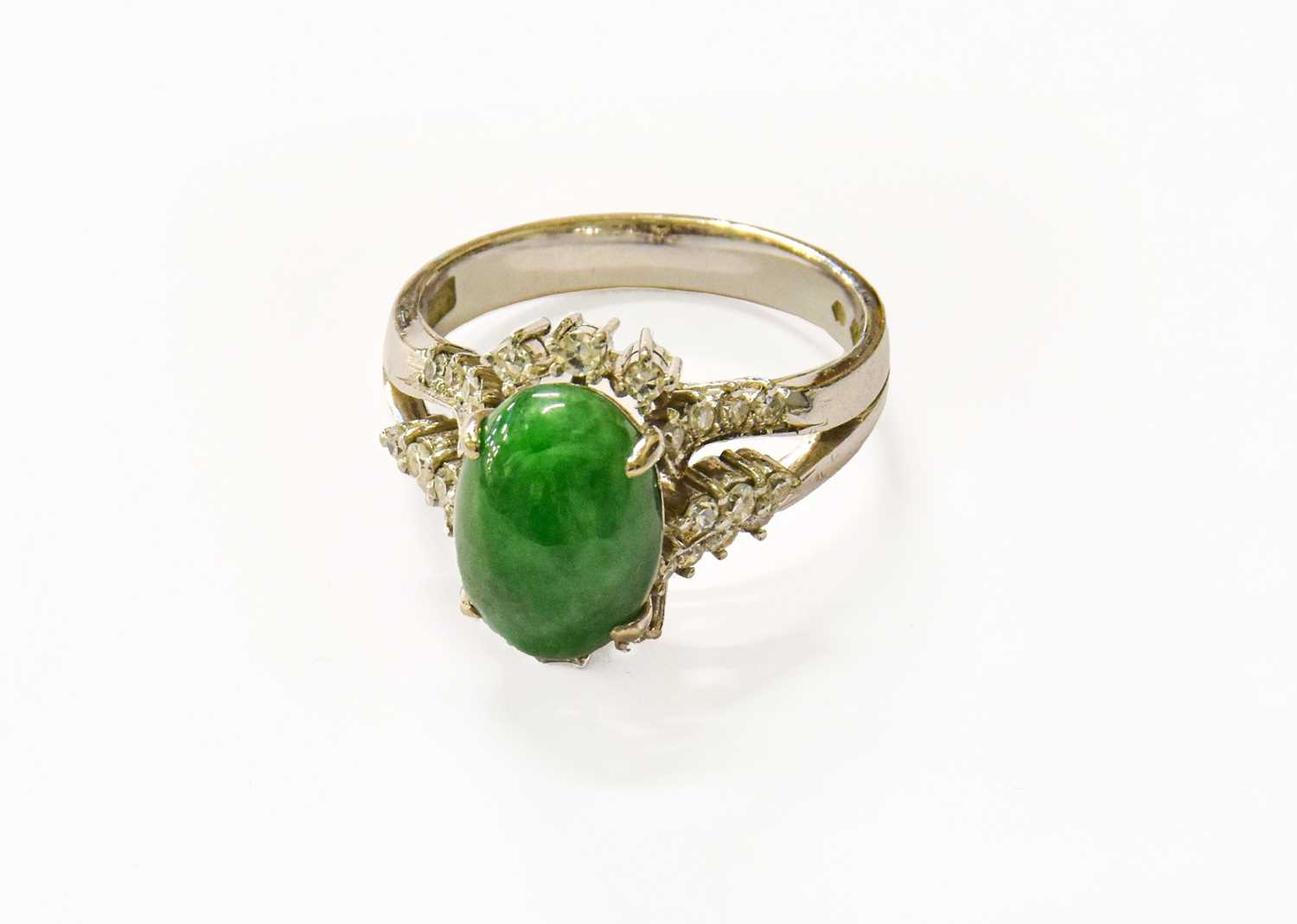 Lot 101 - A Chinese Green Hardstone and Diamond