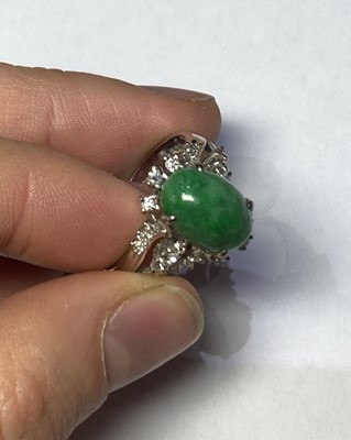 Lot 101 - A Chinese Green Hardstone and Diamond Cluster...