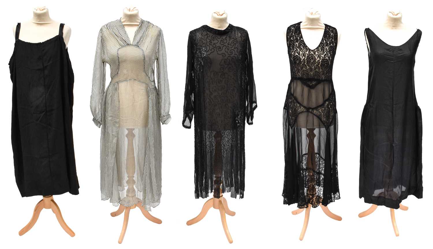 Lot 2095 - Early 20th Century Dresses comprising a black...