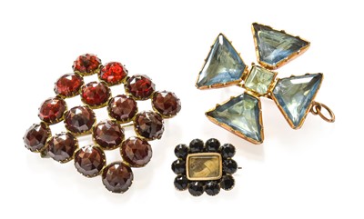 Lot 59 - Three Brooches, comprising of a garnet and...