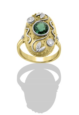 Lot 2287 - A Green Tourmaline and Diamond Ring a round...