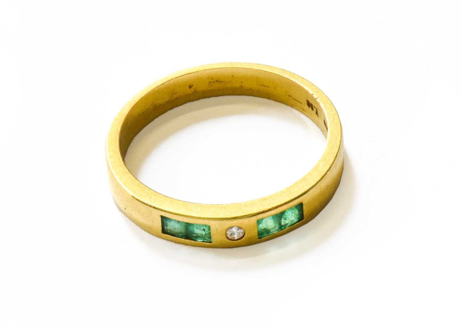 Lot 44 - An Emerald and Diamond Half Hoop Ring, finger...