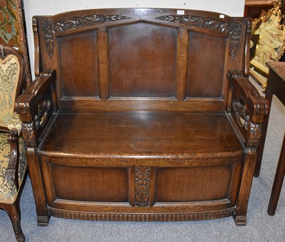 Lot 1210 - A 1920's Oak Monk Bench, 113cm by 54cm by 102cm