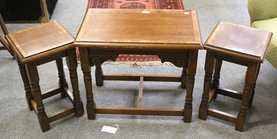 Lot 1226 - A Nest of Three Cross banded Oak Tables,...