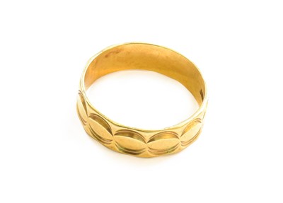 Lot 114 - A Textured Band Ring, stamped '18CT', finger...