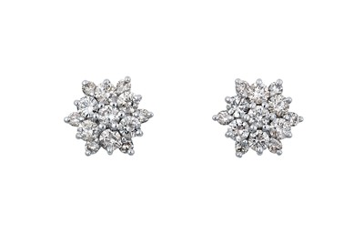 Lot 2073 - A Pair of Diamond Cluster Earrings the central...