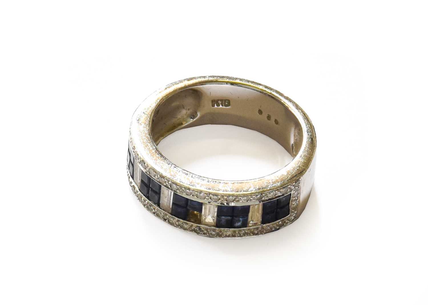 Lot 54 - A Sapphire and Diamond Half Hoop Ring, stamped...