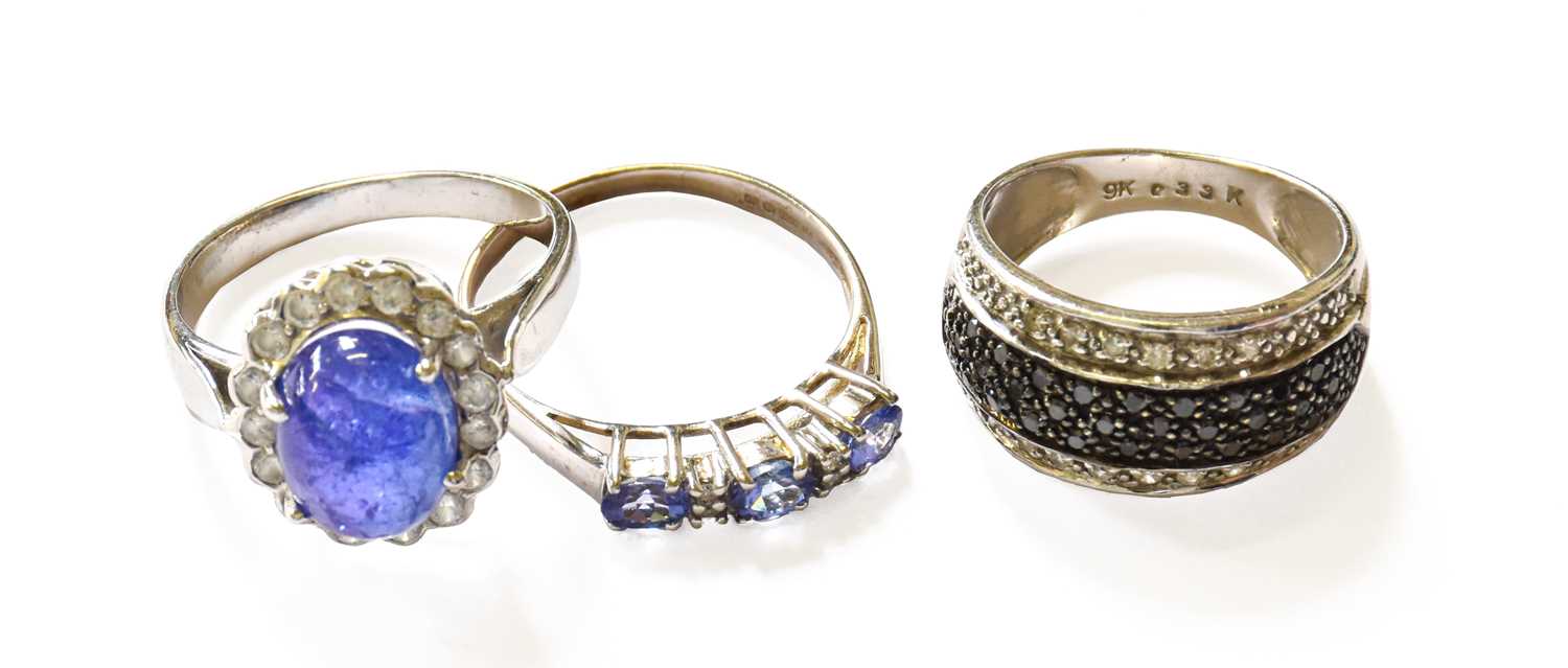 Lot 32 - Three Gem-Set Rings, comprising of a black and...