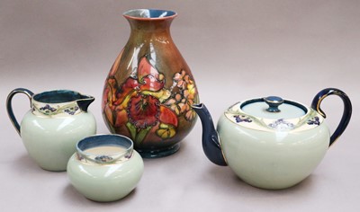Lot 300 - A Moorcroft Pear Shaped Vase, flambe orchids...
