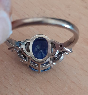 Lot 2076 - A Sapphire and Diamond Ring the cushion shaped...