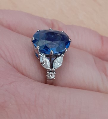 Lot 2076 - A Sapphire and Diamond Ring the cushion shaped...