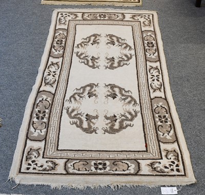 Lot 1222 - A Nepalese Rug, the ivory field with three...