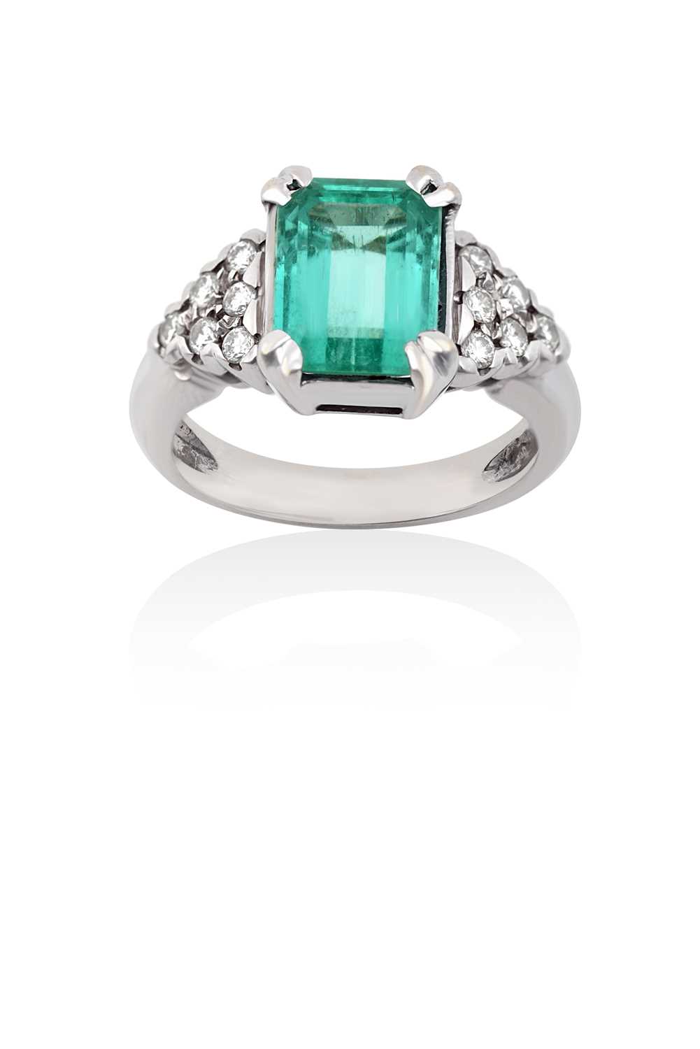 Lot 2032 - An Emerald and Diamond Ring the emerald-cut...