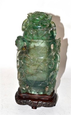 Lot 189A - A Chinese Carved Green Spa Vase and Cover, late Qing Dynasty, of flattened ovoid form, in...