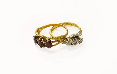 Lot 99 - A 9 Carat Gold Garnet Three Stone Ring, finger...