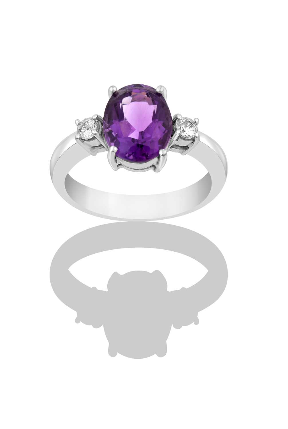 Lot 2344 - An Amethyst and Diamond Three Stone Ring the...