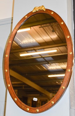 Lot 1403 - An Inlaid Oak Oval Hanging Wall Mirror, with...