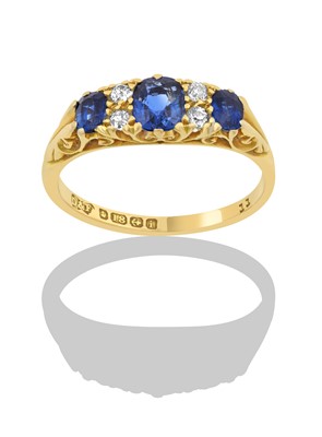 Lot 2369 - An 18 Carat Gold Sapphire and Diamond Ring...