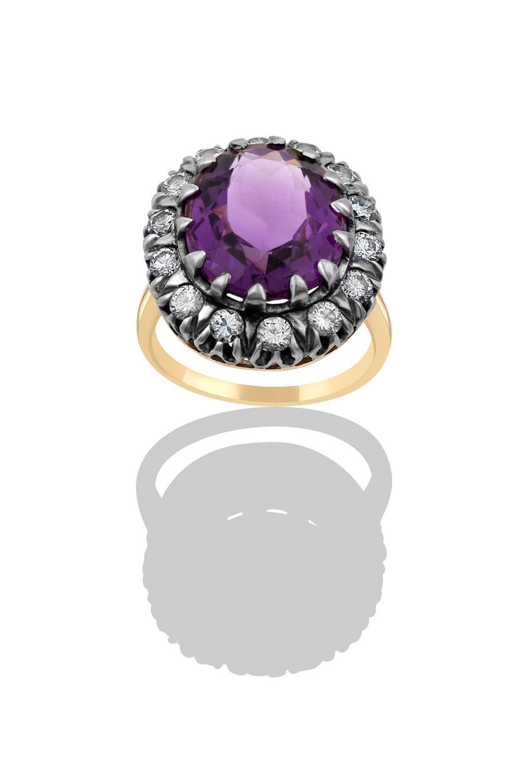 Lot 2414 - An Amethyst and Diamond Cluster Ring the oval...