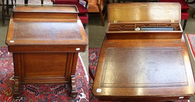 Lot 1388 - A Late Victorian Oak Davenport, with brass...