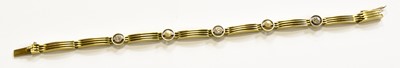 Lot 244 - A Diamond and Cultured Pearl Bracelet, stamped...