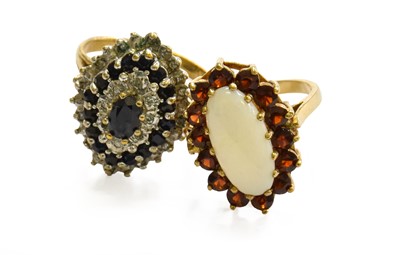 Lot 217 - A 9 Carat Gold Opal and Garnet Cluster Ring,...
