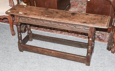 Lot 1240 - An 18th Century Oak Joint Stool, with chip...