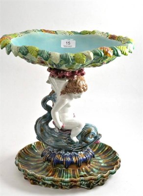 Lot 15 - A Majolica centrepiece modelled as Cupid riding a dolphin beneath a fern basket, possibly...