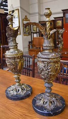 Lot 1295 - A Pair of Gilt Metal Ewer Form Table Lamps, on...