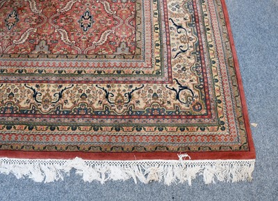 Lot 1220 - An Indian Carpet, the terracotta field with an...