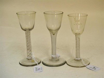 Lot 4 - A Wine Glass, circa 1750, the rounded funnel bowl on an air twist stem and circular foot,...