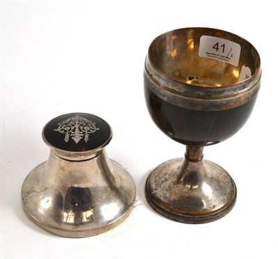 Lot 41 - A coconut cup goblet with plated mounts and a silver and tortoiseshell capstan inkwell