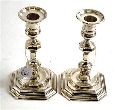 Lot 62 - A pair of silver candlesticks in the George II style, Sheffield 1967