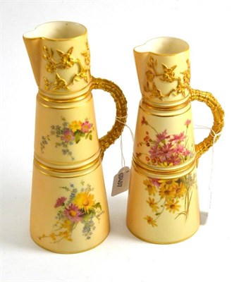 Lot 63 - Two Royal Worcester peach bloom graduated jugs