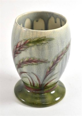 Lot 64 - A William Moorcroft vase, tube lined with barley