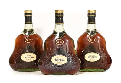 Lot 5190 - Hennessy X.O. Cognac (three bottles)