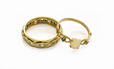 Lot 181 - A 9 Carat Gold Opal and Emerald Three Stone...