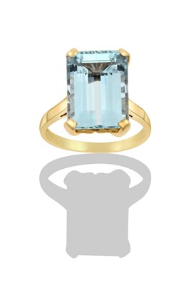 Lot 2347 - An Aquamarine Ring the emerald-cut aquamarine...