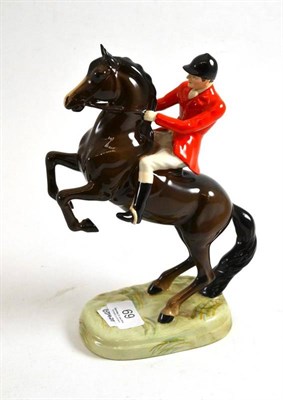 Lot 69 - Beswick huntsman on rearing brown horse