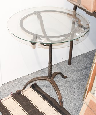 Lot 1180 - A Wrought Iron Glass Top Patio Table, 61cm...